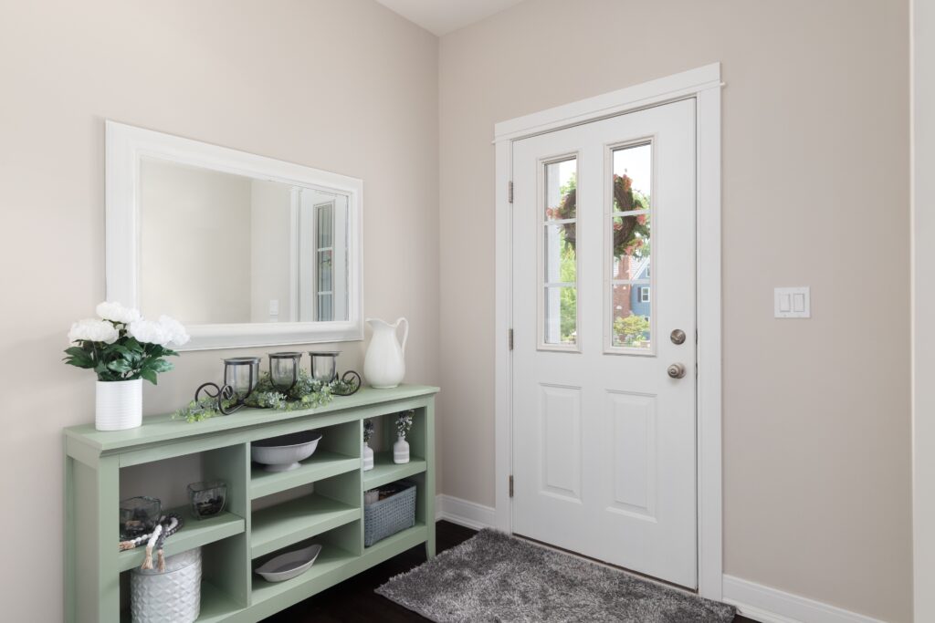 A,Cozy,Entryway,With,Brown,Walls,,A,Green,Console,Table