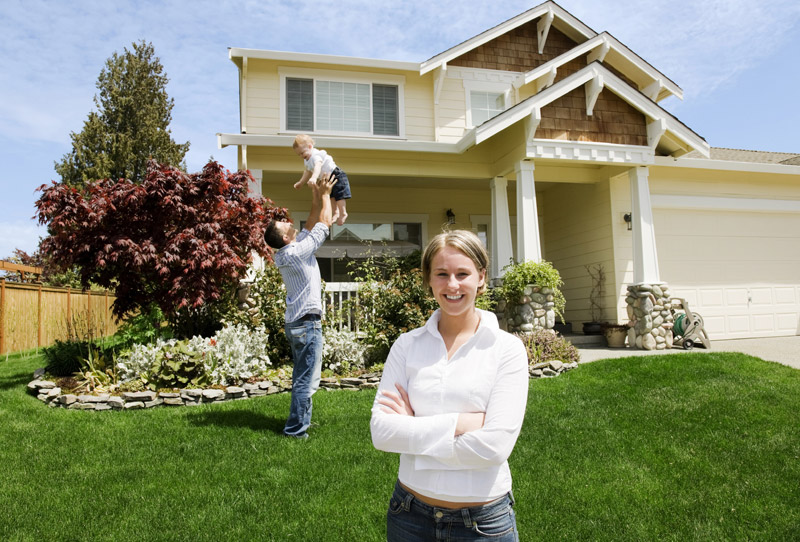 Family in front of house